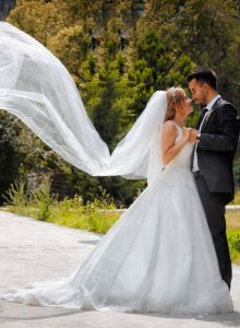 bride and groom in the wind