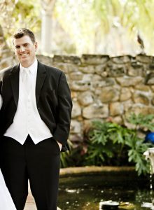 bride and groom by the pond