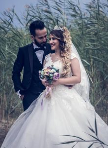 bride and groom by the reeds