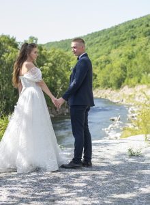 bride and groom by the stream