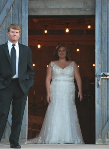 bride and groom in the barn